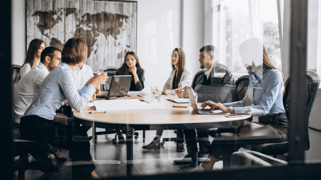 Business men and women in conference room discussing how ASBR helps businesses thrive.
